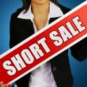 Lady Holding Short Sale Sign