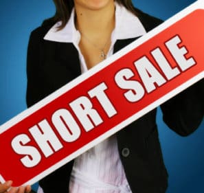 Lady Holding Short Sale Sign