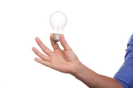 Home selling ideas and tips - hand holding light bulb