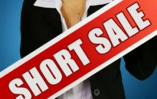 Lady Holding Short Sale Sign